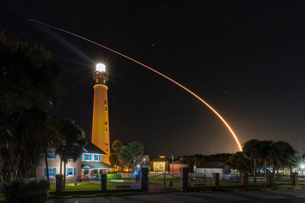 2 - The SpaceX Falcon 9 flies over the Ponce Inlet lighthouse from launchpad 39A at Kennedy Space Center.