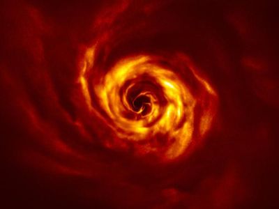 At the center of the swirl, a bright yellow spot is has a characteristic twist that indicates the birth of a new exoplanet.