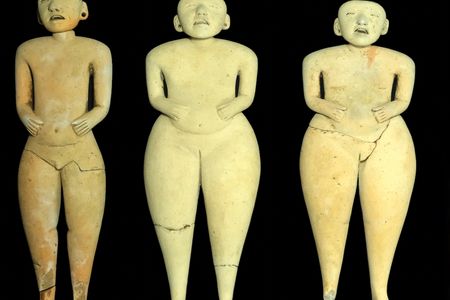 The three larger figurines measure about a foot tall.