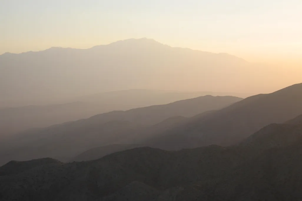 Hazy sunset with mountains