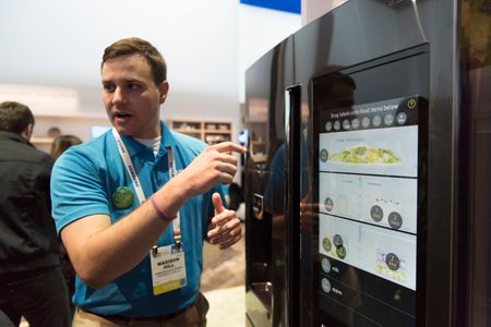 Madison Hill of Samsung demonstrates a Family Hub Refrigerator at the 2016 Consumer Electronics Show in Las Vegas.