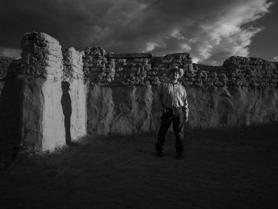 Genízaro Delvin Garcia standing in remains of the 18th-century Santa Rosa de Lima Church. Abiquiú, New Mexico, 2019. (© 2020 Russel Albert Daniels) 