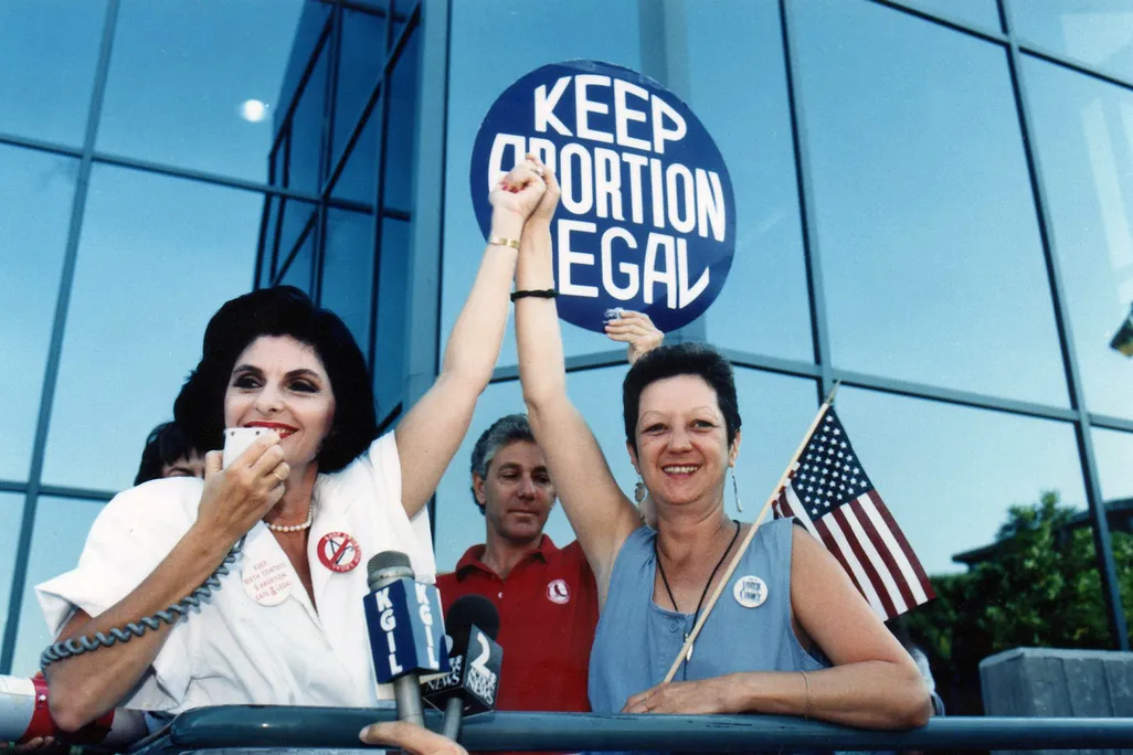 Attorney Gloria Allred (left) and Norma McCorvey (right), the anonymous plaintiff in Roe v. Wade, during a pro-choice rally in Burbank, California, on July 4, 1989