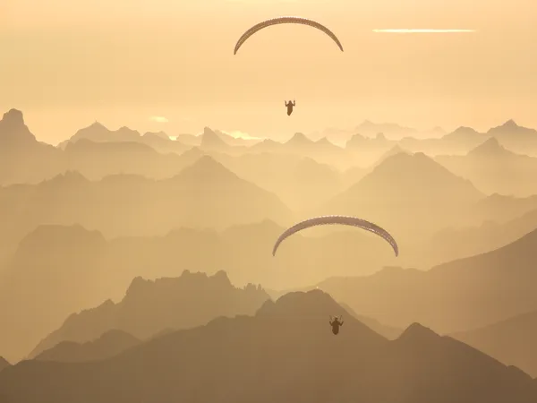 2 paragliders sunset Zugspitze Austria thumbnail