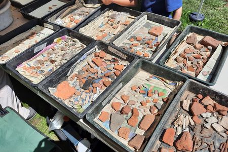 Along with stretches of cobblestone path, researchers found pottery and Roman coins.