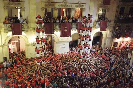 Teams compete to form the tallest human towers, called castells—a centuries-old activity that creates quite the spectacle in Catalan public spaces.