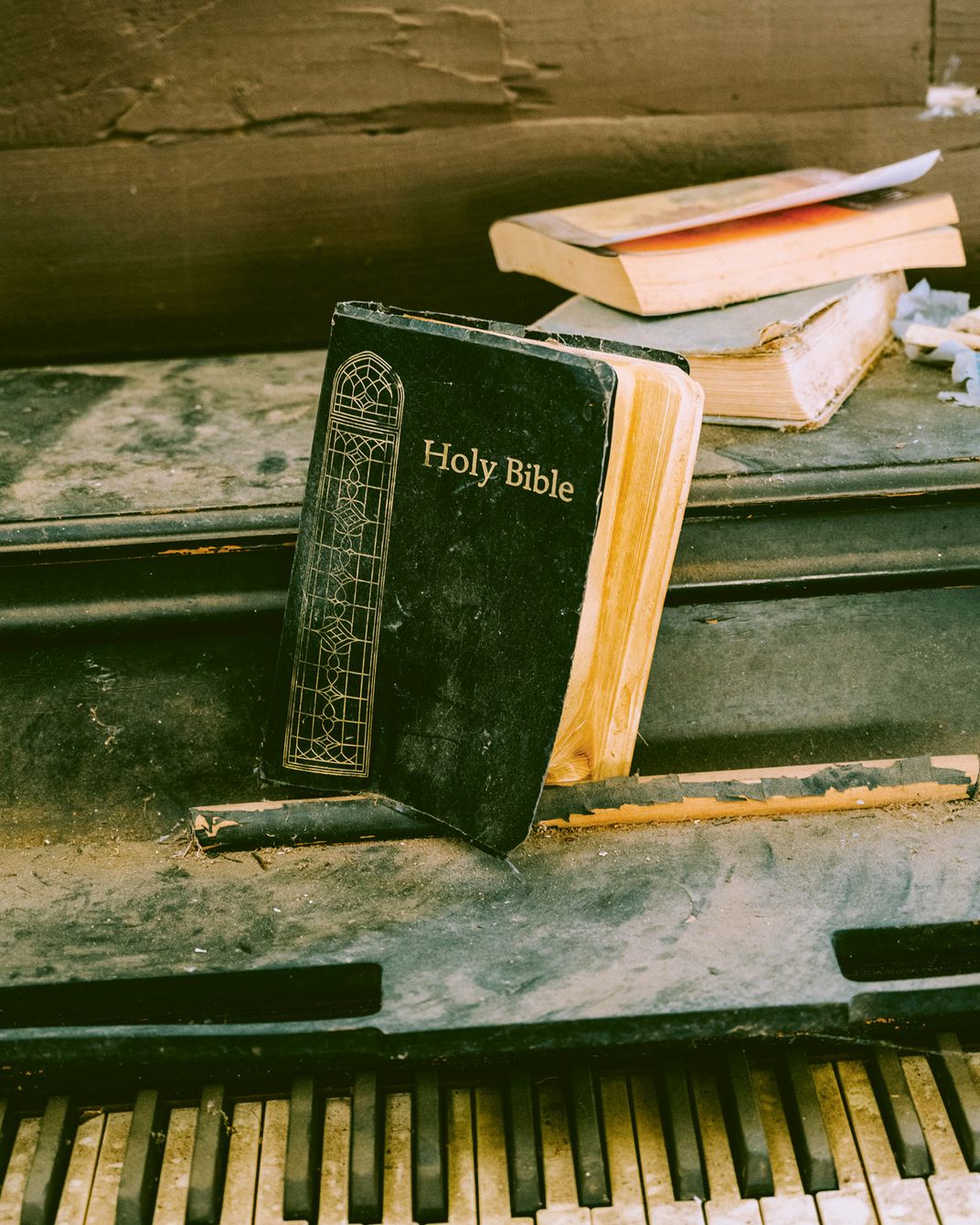 A bible sits on a piano