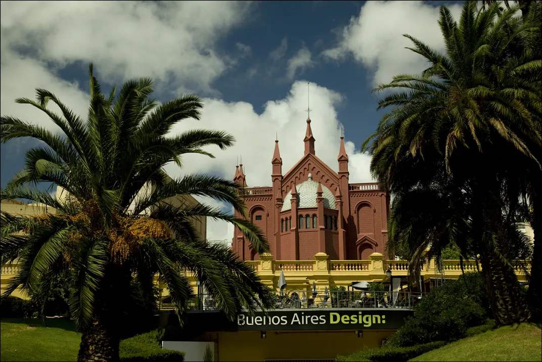 A historic building with palm trees
