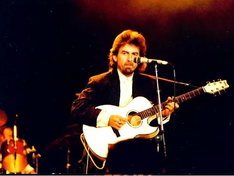 George Harrison playing guitar