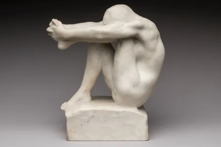 Titled The&nbsp;Despair, the sculpture depicts a woman holding her leg.
