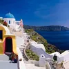 Brightly colored homes line the caldera in Santorini, a contrast to much of the blue-and-white motif.