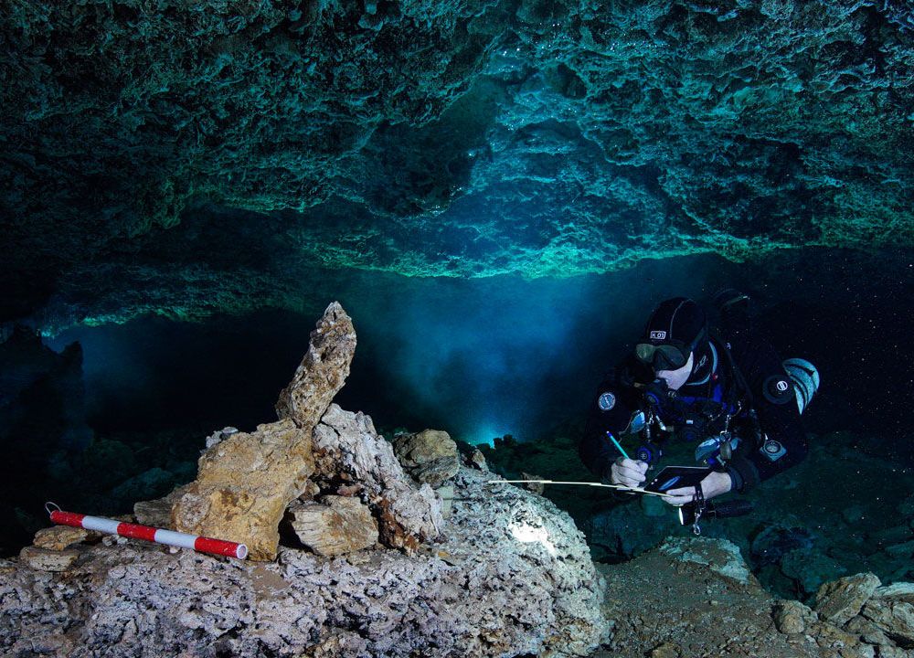 Diver examines rock pile