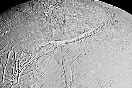 A mosaic of Enceladus collected by Cassini showing deep fissures or sulci