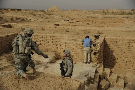 American soldiers in Nimrud in 2008, with the Ziggurat in the background.