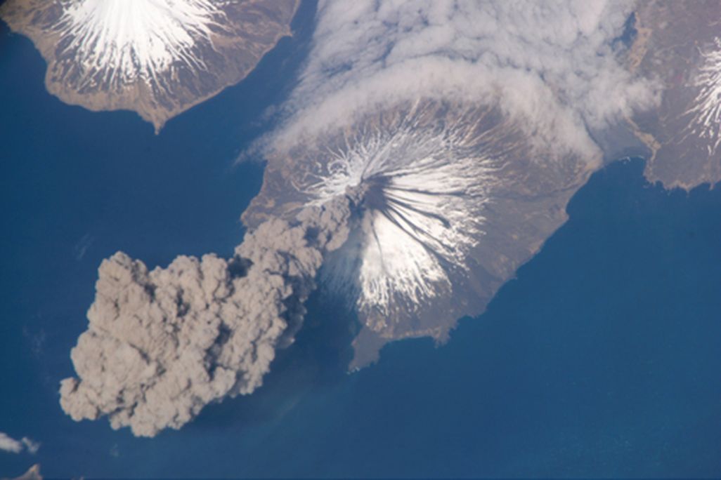 Space station astronauts catch an Alaskan volcano blowing its stack.