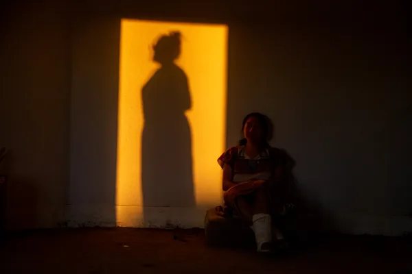Navajo Women Rest in the Hogan During a Maturation Ceremony thumbnail
