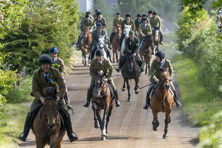 Riders gallop during the Hawick Common Riding in Scotland.