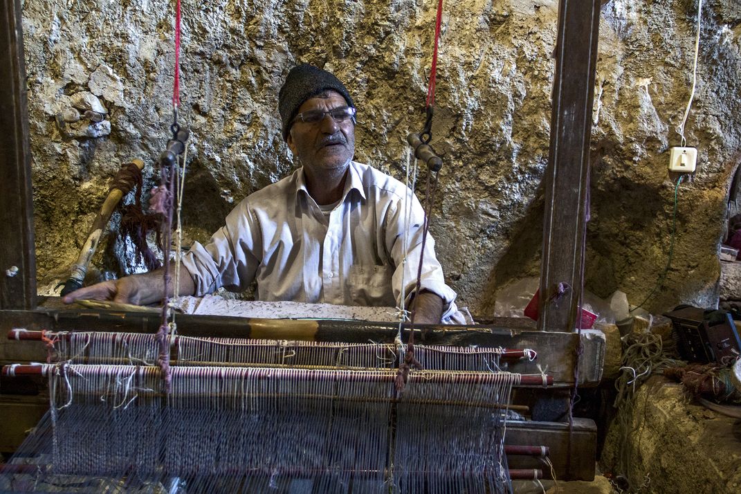 A traditional textile worker camera model:canon 50D exposure time:1 ...
