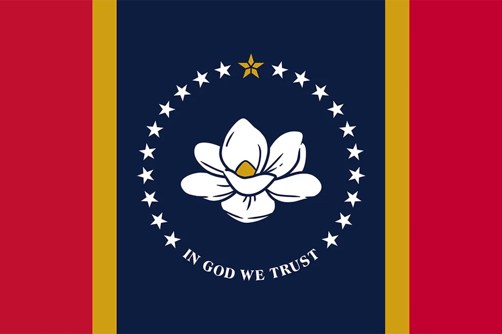 Two vertical thick red stripes and thin gold stripes flank either side of a navy blue stripe in the center, which boasts a large blooming white magnolia flower, its petals unfurling. Circled by 20 stars and white text below: "IN GOD WE TRUST"