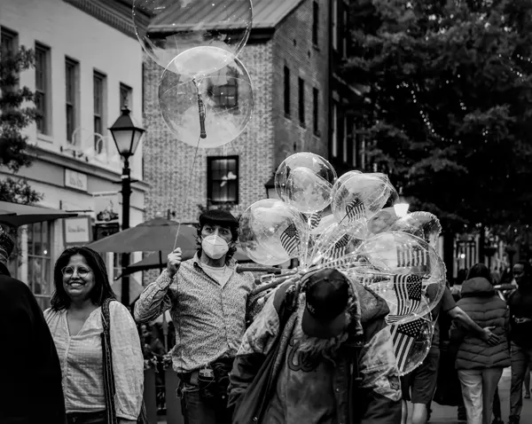 A man carrying an American flag thumbnail