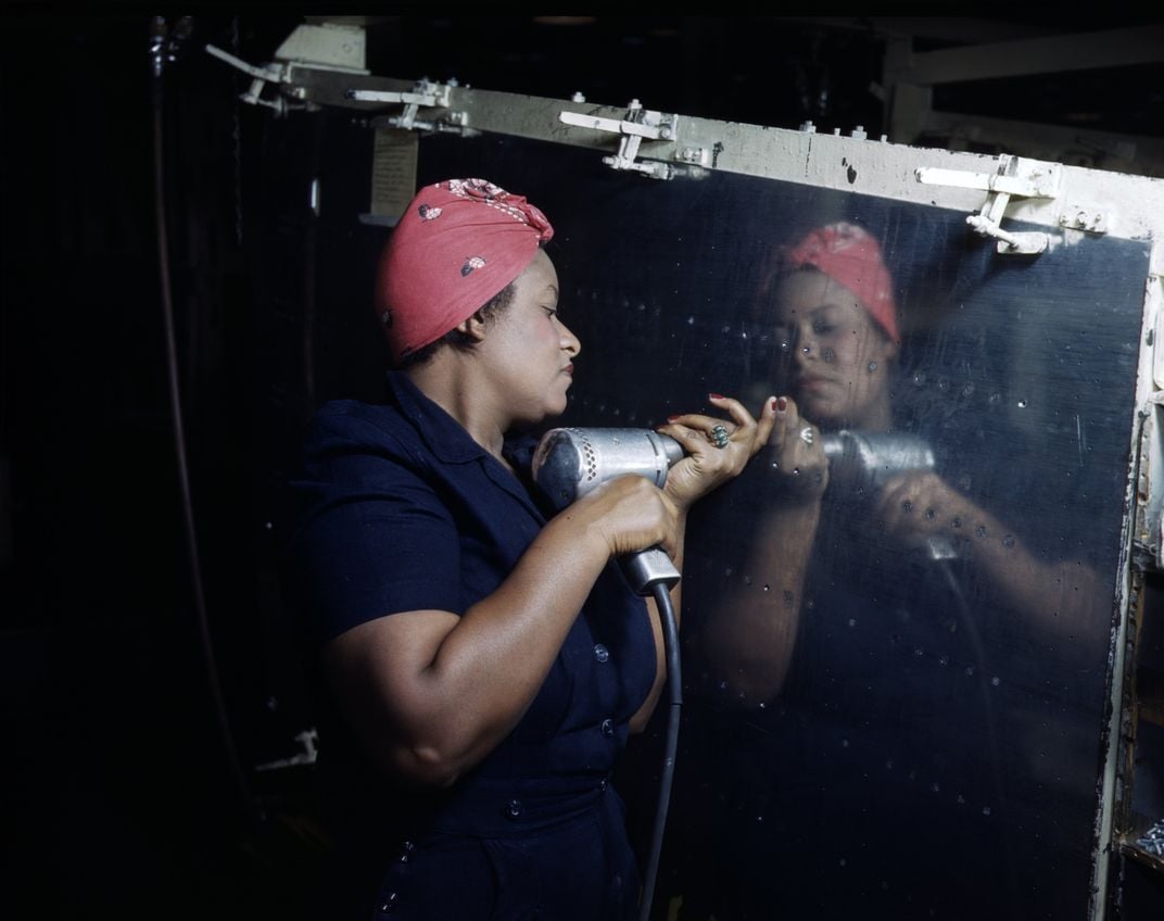 Woman Operates a hand drill at Vultee-Nashville, working on a 'Vengeance' dive bomber, Tennessee.