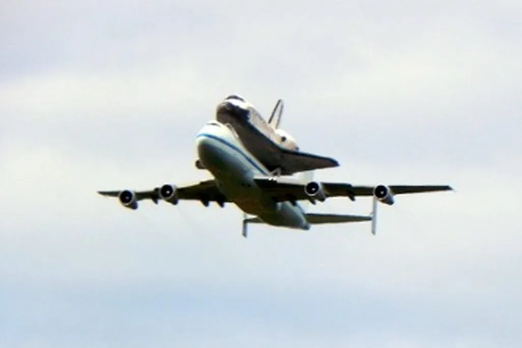 Space Shuttle Discovery flies over Washington, DC.
