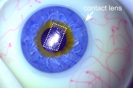 A new, ultra thin circuit, shown embedded on a contact lens placed on a prosthetic eye.