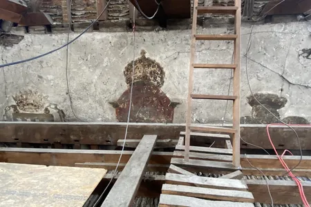 Found by workers during recent restorations, the wall paintings feature three crowned motifs.