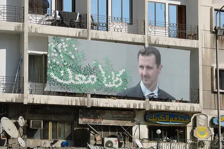 A poster for Syrian President Bashar al-Assad hangs in Damascus.