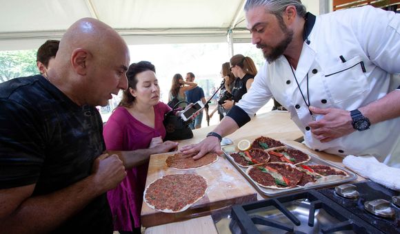 Anto Kilislian prepares lahmajoun at the 2018 Smithsonian Folklife Festival. (Photo by Sonya Pencheva, Ralph Rinzler Folklife Archives)
