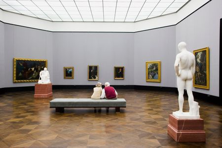People view a painting at the Altes Museum in Germany. As populations age and address various health challenges, museums are increasingly tailoring their programming to better serve their patrons.