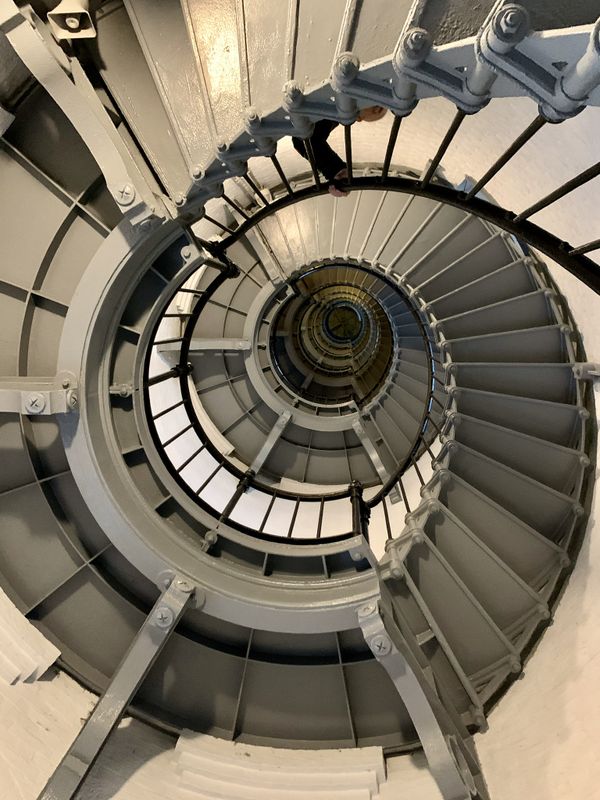 Looking up the spiral stair case in a light house thumbnail