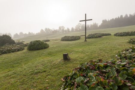 A cross marks the death of the 340 murdered villagers of Lidice.