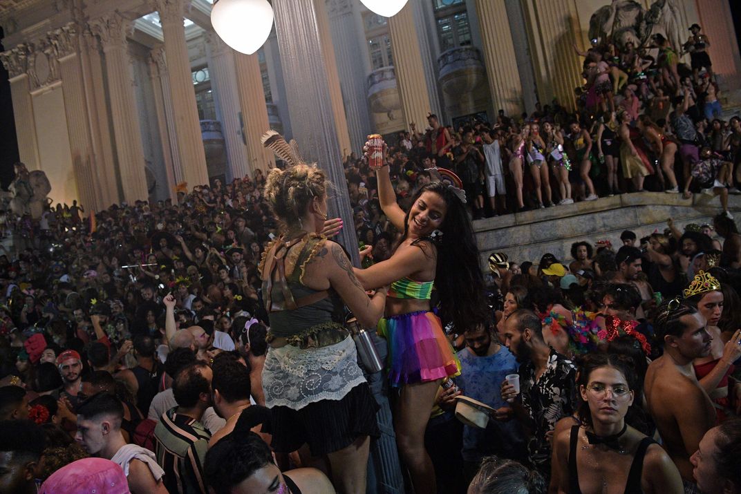 Thousands of people gather at an unofficial street party known as a Bloco in Rio de Janeiros city centre, Brazil, on February 27, 2022. - Carnival street parties in public places in the city have been banned but are taking place in large numbers. The Worl