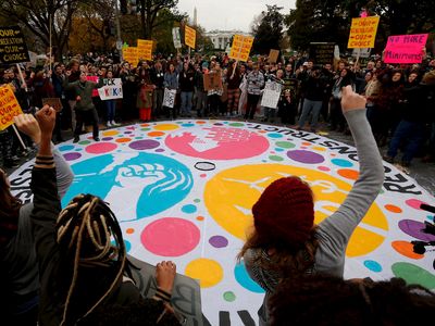 Youth gather near the White House as part of the "Our Generation, Our Choice" climate change march on November 9, 2015