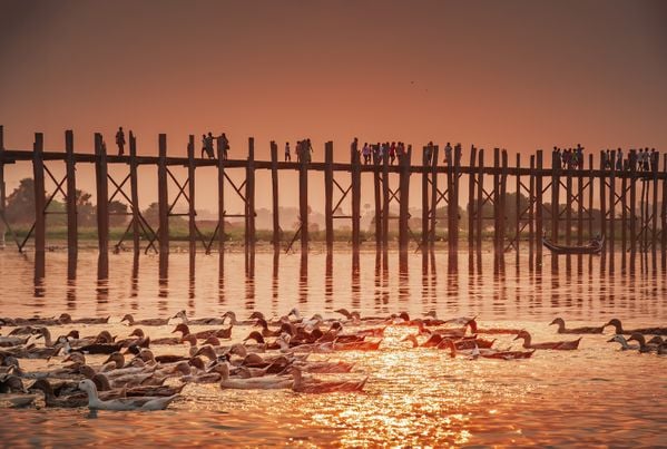 sunset at U Bein Bridge in Mandalay, Myanmar thumbnail