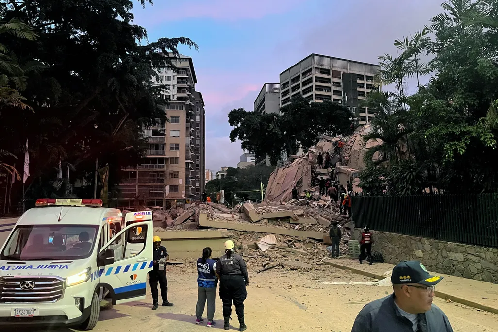 Rescuers search for victims in a collapsed building following an earthquake in Caracas on June 24, 2026