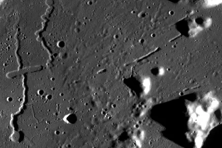 Sinuous rilles (lava channels and tubes) of the Rima Prinz complex in Oceanus Procellarum.  Some segments of rilles are roofed over to form a tube (the "gap" between the linear features at right center), which might be drained of lava, forming a cave. This area is in a mare region, where internally generated bodies of liquid rock (magma) are erupted as lava.