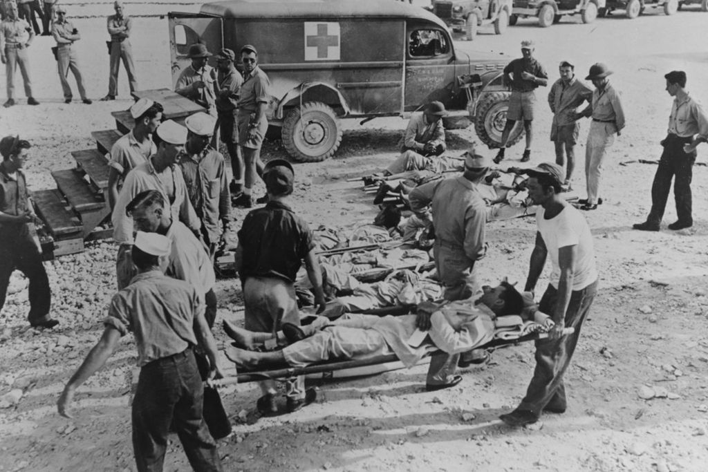 Survivors of the Indianapolis en route to a hospital following their rescue in August 1945