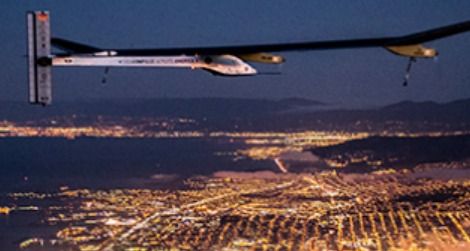 The Solar Impulse flying over San Francisco at night.