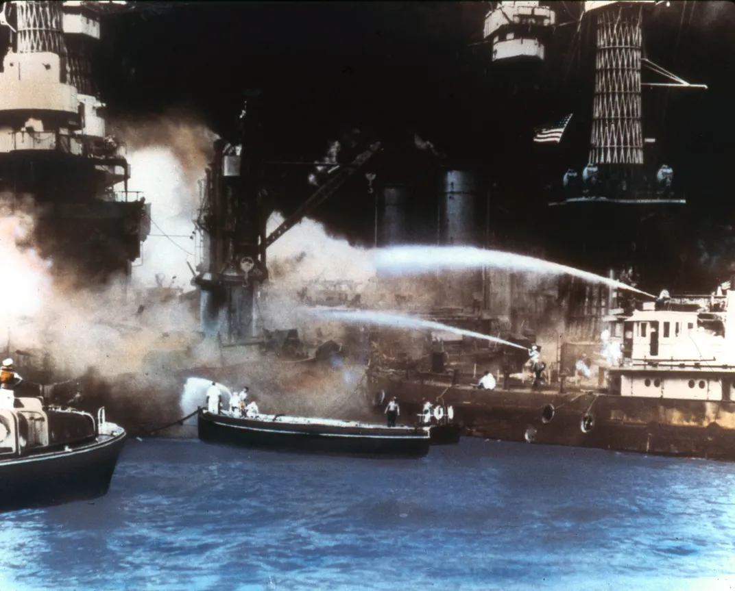 Sailors attempt to extinguish fires on the U.S.S. West Virginia.
