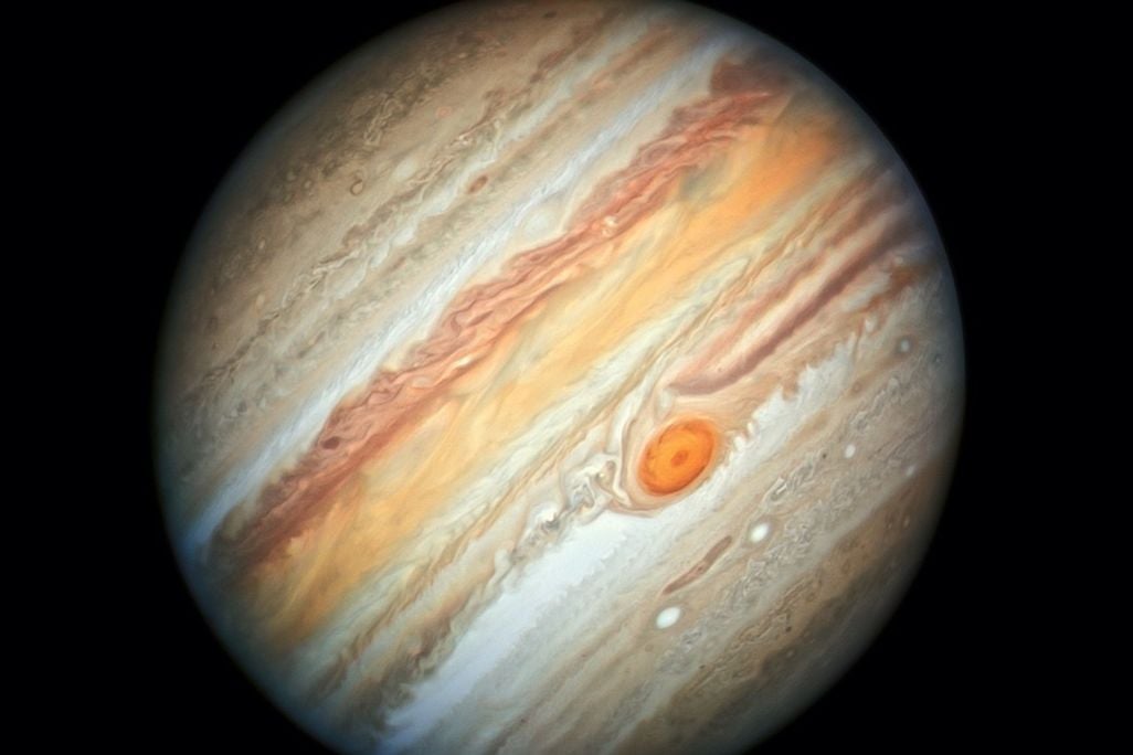 Jupiter, tilted, with its bands and Great Red Spot clearly visible