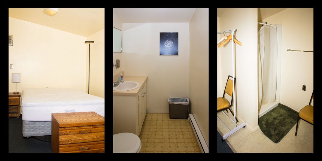 three images: a bed without sheets, a small bathroom with a photo of a spiral galaxy on the wall, a small closet and shower
