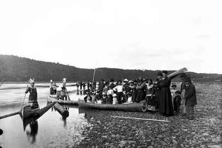 Malacites of the Wanabaki Confederacy standing along the edge of the water at French village, Kingsclear, celebrating Corpus Christi Day, ca 1887.
