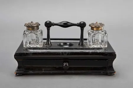 From the desk of Susan B. Anthony, this inkstand was used  by the women's rights advocate to produce the articles she wrote for her newspaper The Revolution.