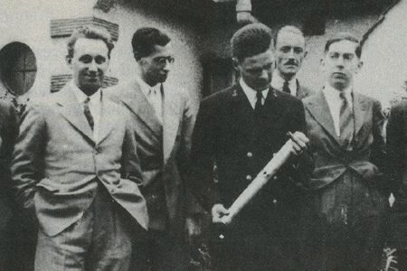 Arthur C. Clarke (far right) and other members of the British Interplanetary Society had a visit from rocket pioneer Robert Truax (holding the rocket model) in 1938.