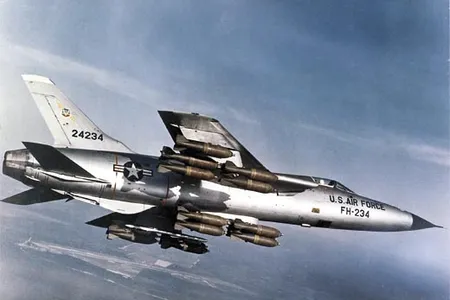 During a flight demonstration Stateside, an F-105 carries a full bomb load: 16 750-pounders. While attacking targets in Vietnam, though, Thuds were generally outfitted with 6,000 pounds of bombs and two auxiliary fuel tanks.
