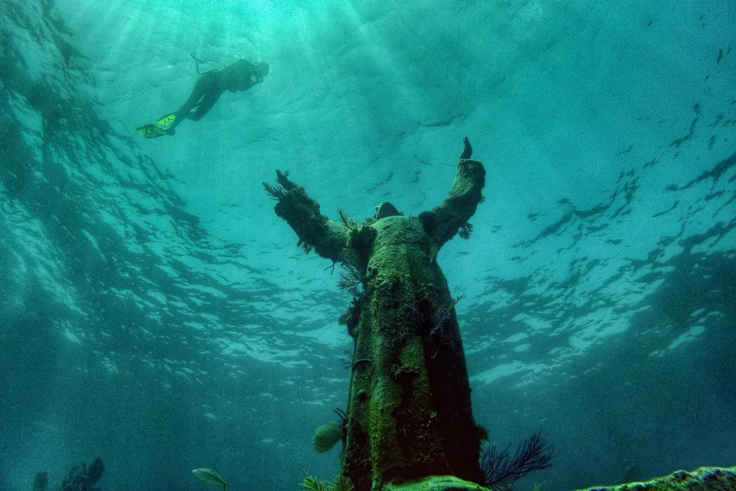 See How Divers Clean This Statue of Jesus Christ Submerged Nearly 60 Feet  Below the Surface of the Mediterranean