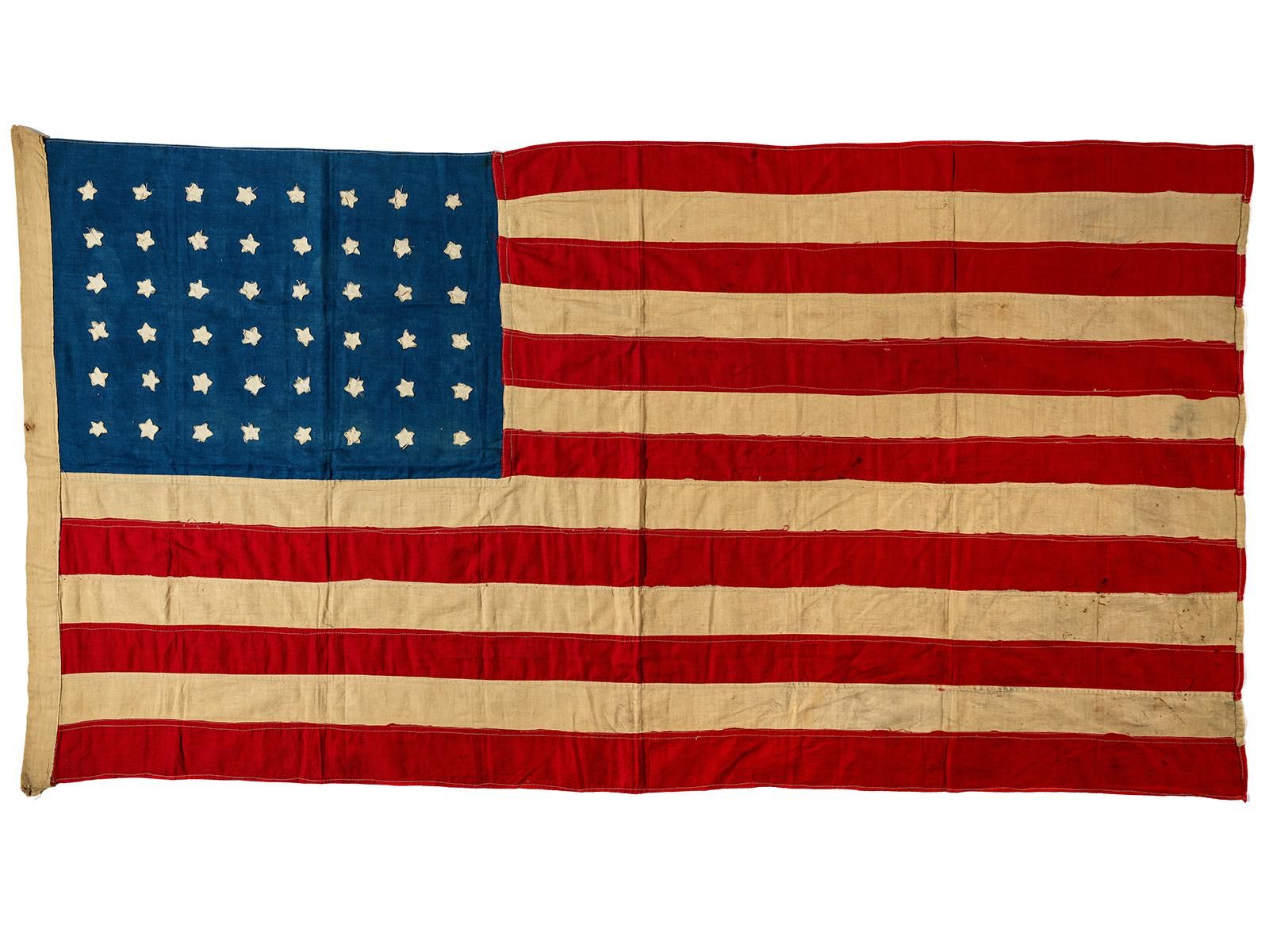A Hundred-Year-Old Handmade American Flag Flies Home. . . to