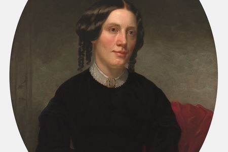 Oil painting portrait of Harriet Beecher Stowe seated with her hands folded in her lap.
